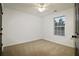 Bright bedroom with neutral carpeting and ceiling fan at 2555 Flat Shoals Rd # 3005, South Fulton, GA 30349