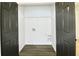 Laundry room with wire shelving, vinyl flooring, and washer/dryer hookups at 2555 Flat Shoals Rd # 3005, South Fulton, GA 30349