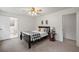 Cozy bedroom with carpeted floor, ceiling fan, and en-suite bathroom at 2343 Meadow Dr, Snellville, GA 30078