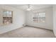 Spacious bedroom with two windows, carpet and ceiling fan at 2343 Meadow Dr, Snellville, GA 30078