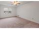 Spacious bedroom with carpeted floor and ceiling fan at 2343 Meadow Dr, Snellville, GA 30078