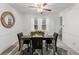 Dining room with dark wood table and neutral decor at 2343 Meadow Dr, Snellville, GA 30078