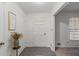 Bright entryway with tiled floor and coat closet at 2343 Meadow Dr, Snellville, GA 30078