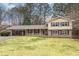 Brick ranch house with covered carport and landscaped yard at 2343 Meadow Dr, Snellville, GA 30078