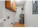 Laundry room with washer and dryer hookups and overhead cabinets at 2343 Meadow Dr, Snellville, GA 30078