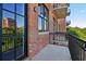 Private balcony with brick wall and city views at 3235 Roswell Ne Rd # 716, Atlanta, GA 30305