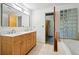 Bathroom with double vanity and glass block window at 3235 Roswell Ne Rd # 716, Atlanta, GA 30305