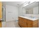 Bathroom with double vanity and large mirror at 3235 Roswell Ne Rd # 716, Atlanta, GA 30305