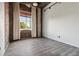 Spacious bedroom with exposed brick and hardwood floors at 3235 Roswell Ne Rd # 716, Atlanta, GA 30305