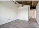 Spacious bedroom with exposed brick wall and hardwood floors at 3235 Roswell Ne Rd # 716, Atlanta, GA 30305