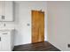 Modern entryway with wood door and white kitchen cabinets at 3235 Roswell Ne Rd # 716, Atlanta, GA 30305