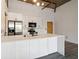 Modern kitchen with white cabinets, stainless steel appliances & quartz countertops at 3235 Roswell Ne Rd # 716, Atlanta, GA 30305