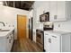 Modern kitchen with white cabinets, stainless steel appliances & quartz countertops at 3235 Roswell Ne Rd # 716, Atlanta, GA 30305