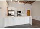 Modern kitchen with white cabinets, island, stainless steel appliances & quartz countertops at 3235 Roswell Ne Rd # 716, Atlanta, GA 30305