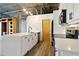 Modern kitchen with white cabinets, stainless steel appliances & quartz countertops at 3235 Roswell Ne Rd # 716, Atlanta, GA 30305