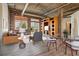 Virtually staged living and dining area with exposed brick at 3235 Roswell Ne Rd # 716, Atlanta, GA 30305