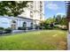 Elegant courtyard with manicured lawn and building in background at 199 14Th Ne St # 1209, Atlanta, GA 30309