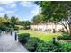 Spacious grassy courtyard with pergola, seating, and landscaping at 199 14Th Ne St # 1209, Atlanta, GA 30309