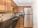 Modern kitchen with stainless steel appliances and granite countertops at 199 14Th Ne St # 1209, Atlanta, GA 30309