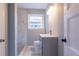 Updated bathroom with a gray vanity and walk-in shower at 3377 Bobolink Cir, Atlanta, GA 30311