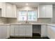 Newly remodeled kitchen with white shaker cabinets and quartz countertops at 3377 Bobolink Cir, Atlanta, GA 30311