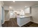 Renovated kitchen features white cabinets, quartz countertops, and dark hardwood floors at 3377 Bobolink Cir, Atlanta, GA 30311