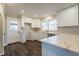 Updated kitchen boasts white cabinets, quartz countertops, and stylish flooring at 3377 Bobolink Cir, Atlanta, GA 30311