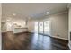 Spacious living area with hardwood floors, fireplace, and access to patio at 3377 Bobolink Cir, Atlanta, GA 30311