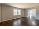 Hardwood floor living room with large windows at 3377 Bobolink Cir, Atlanta, GA 30311