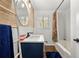 Modern bathroom with white subway tiles and a navy blue vanity at 2609 Riggs Dr, Atlanta, GA 30344