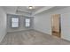 Main bedroom with high ceilings, neutral carpeting and two windows at 2732 Rigby Ln, Duluth, GA 30097