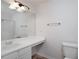 Bright bathroom featuring a vanity and mirror with a shower to the left at 5665 Terremont Cir, Norcross, GA 30093