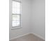 Neutral bedroom with carpet and a window with mini-blinds at 5665 Terremont Cir, Norcross, GA 30093