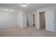 Neutral bedroom featuring carpet flooring and entry to closet and bathroom at 5665 Terremont Cir, Norcross, GA 30093