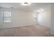 Spacious bedroom with plush carpet, dual windows, and ample natural light at 5665 Terremont Cir, Norcross, GA 30093