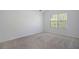 Bright bedroom with natural light streaming through the large window at 5665 Terremont Cir, Norcross, GA 30093