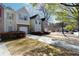 View of two story townhomes with attached garages, driveways, and manicured shrubs at 5665 Terremont Cir, Norcross, GA 30093