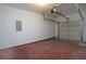 Attached garage with an opener and a painted floor at 5665 Terremont Cir, Norcross, GA 30093