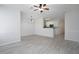 Open floor plan view of living room, dining area, and kitchen with white cabinets at 5665 Terremont Cir, Norcross, GA 30093
