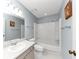 Clean bathroom with a shower/tub combo and vanity at 5863 Wintergreen Rd, Norcross, GA 30093