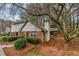 Townhome exterior showcasing a side view and private backyard at 5863 Wintergreen Rd, Norcross, GA 30093