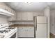 Efficient kitchen with light cabinets, ample counter space, and modern appliances at 5863 Wintergreen Rd, Norcross, GA 30093