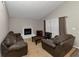 Living room featuring a cozy fireplace and comfortable seating arrangement at 5863 Wintergreen Rd, Norcross, GA 30093