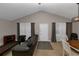 Spacious living room with vaulted ceiling, neutral decor, and ample natural light at 5863 Wintergreen Rd, Norcross, GA 30093