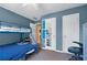 Blue bedroom with bunk beds and a desk at 3740 Garnet Way, Snellville, GA 30039