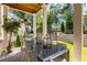 Outdoor dining area on a covered patio with a view of the backyard at 771 Arrendale Dr, Marietta, GA 30064