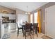 Kitchen and dining area with four chairs and large window at 3367 Lineview Dr, Ellenwood, GA 30294