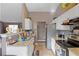 Galley style kitchen with granite countertops and white cabinets at 3367 Lineview Dr, Ellenwood, GA 30294