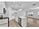 Bright kitchen with island featuring granite countertops and stainless steel appliances at 4101 Fulson Dr, Lilburn, GA 30047