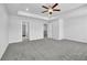 Spacious main bedroom with ceiling fan and access to bathroom at 4101 Fulson Dr, Lilburn, GA 30047